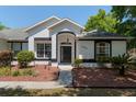 Charming single-story home features an attached garage, manicured lawn, and mature landscaping at 19395 Sw 100Th Loop, Dunnellon, FL 34432