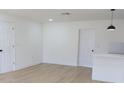 Bright living room with new floors, white walls, and doors with modern hardware, freshly painted at 3807 Sw 143Rd Lane Rd, Ocala, FL 34473
