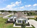 Well-kept home with a manicured lawn, complemented by classic blue shutters at 4721 Se 36Th St, Ocala, FL 34480