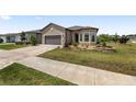 A well-maintained lawn and landscaped garden beds accentuate the home's curb appeal at 9063 Sw 59Th Lane Rd, Ocala, FL 34481