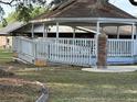 Community gazebo with ramp access and brick columns, perfect for relaxing and enjoying the outdoors at 10980 Sw 63Rd Ave, Ocala, FL 34476