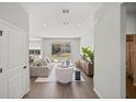 Bright living room with wood floors, neutral decor, and sliding doors to the backyard at 15769 Sw 37Th Cir, Ocala, FL 34473