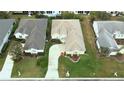 An aerial view highlighting the home in its neighborhood context, with lawn, driveway, and roof at 2323 Nw 55Th Avenue Rd, Ocala, FL 34482