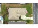 An aerial perspective showing the home's roof, driveway, and landscaping from directly above at 2323 Nw 55Th Avenue Rd, Ocala, FL 34482