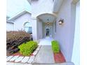 Inviting front entrance features manicured landscaping and covered porch at 2323 Nw 55Th Avenue Rd, Ocala, FL 34482