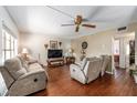 Spacious living room featuring recessed lighting, plush seating, and an entertainment center with a large TV at 2433 Ne 7Th St # 3, Ocala, FL 34470