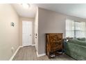 Welcoming foyer features wood-look flooring and a charming storage cabinet at 31 Palm Rd, Ocala, FL 34472