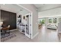 Bright, open-concept living room featuring tile floors and a view to a dining room and office space at 4172 Sw 53Rd Lane Rd, Ocala, FL 34474