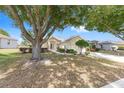 Charming single story home with manicured lawn, lovely landscaping and walkway to front door at 9693 Sw 90Th St, Ocala, FL 34481