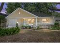 Charming single-story home with a quaint front porch and beautifully landscaped yard at 9726 Sw 94Th Ter # C, Ocala, FL 34481