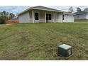 Well-maintained lawn leading to a lovely single-story home with large windows at 21 Pl # 14443, Ocala, FL 34481