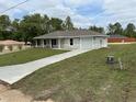 Newly constructed home with fresh lawn, paved driveway and attached garage at 21 Pl # 14443, Ocala, FL 34481
