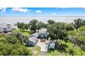 Stunning aerial view of a lakeside home with lush greenery, offering breathtaking views of the tranquil water at 4237 Chambers St, Lake Wales, FL 33898