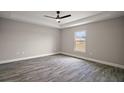 The main bedroom features modern floors, neutral walls, and a ceiling fan at 60 Walnut Dr, Ocala, FL 34480