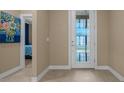 Elegant foyer with a decorative glass door and neutral paint, creating a welcoming entrance at 6376 Sw 97Th Terrace Rd, Ocala, FL 34481