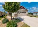 Lovely single-Gathering home with a two car garage and desert landscaping at 9923 Sw 98Th Ln, Ocala, FL 34481