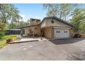 Charming single story home with a brick exterior, front courtyard, two car garage, and a screened pool area at 1179 Se 170Th Ct, Silver Springs, FL 34488