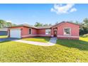 Charming single-Gathering home with a lush green lawn and a two-car garage at 15087 Sw 43Rd Ct, Ocala, FL 34473