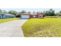 Single-Gathering home with a spacious front yard and a convenient two-car garage at 15087 Sw 43Rd Ct, Ocala, FL 34473