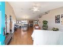 Bright, open-concept living and dining area with hardwood floors and natural light, perfect for entertaining at 173 Juniper Way, Ocala, FL 34480