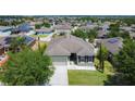 Aerial view of a lovely single-story home in a neighborhood with well-maintained lawns and landscaping at 4013 Ruby Run, Haines City, FL 33844