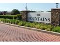 Community sign for The Fountains with brick accents and manicured landscaping at 4677 Nw 46Th Ave, Ocala, FL 34482