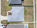 Aerial view of a well-maintained home, showing the roof, yard, pool, and surrounding neighborhood at 4806 Nw 8Th Ter, Ocala, FL 34475