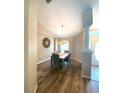 Cozy dining room featuring hardwood floors, neutral paint, and decorative chandelier at 4981 Ne 110Th Street Ne St, Anthony, FL 32617