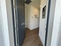 Inviting entryway with a modern front door and stylish wood-look tile flooring at 5785 Sw 87Th Court Rd, Ocala, FL 34481