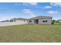 Spacious backyard featuring a well-maintained lawn and a secure white fence, perfect for outdoor enjoyment at 7571 Sw 64Th Street Rd, Ocala, FL 34474