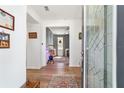 A welcoming foyer with hardwood floors and an ornate glass front door at 8693 Sw 76Th Ln, Ocala, FL 34481