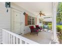 Comfortable front porch featuring seating and a ceiling fan, providing a welcoming entry at 8747 Sw 98Th Street Rd # F, Ocala, FL 34481