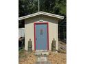 Outdoor shed featuring unique decor and a well-maintained exterior at 8951 Sw 202Nd Avenue Rd, Dunnellon, FL 34431
