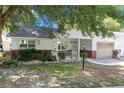 Charming single-story home featuring a well-kept lawn and attached one-car garage on a sunny day at 9855 Sw 85Th Terrace Rd # A, Ocala, FL 34481