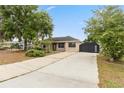 Well-maintained home featuring a long driveway and spacious front yard at 1114 Hickory Rd, Ocala, FL 34472