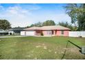 Charming single-story home with a two-car garage, well-manicured lawn, and a welcoming front yard at 13425 Sw 106Th Pl, Dunnellon, FL 34432