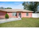 Inviting single-story house with landscaped front yard, white rock features, and a charming front door at 13425 Sw 106Th Pl, Dunnellon, FL 34432