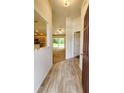 Inviting entryway showcasing wood-look floors and views into the living area at 15407 Sw 59Th Avenue Rd, Ocala, FL 34473