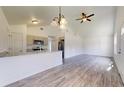 Bright and airy open-concept living space featuring a ceiling fan and modern flooring at 1610 Sw 152Nd Ct, Ocala, FL 34481