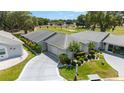 Attractive single-story home with manicured landscaping and an attached two-car garage at 17505 Se 100Th Ct, Summerfield, FL 34491