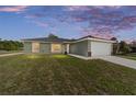 Attractive single-story home with well-maintained lawn in a peaceful neighborhood at 2114 W Magenta Dr, Citrus Springs, FL 34434
