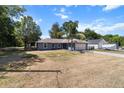 Well-maintained single-story home featuring a lush front yard and a two-car garage at 3112 Se 140Th Ln, Summerfield, FL 34491