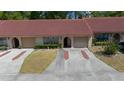 A lovely single-story home with a red tile roof and well-manicured lawn and drive, offering great curb appeal at 3449 Sw 19Th St, Ocala, FL 34474