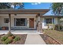 Inviting home featuring a walkway to the front door and lovely landscaping at 408 Etheredge St, Bushnell, FL 33513