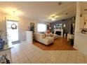 Bright and airy living room featuring wood floors and ample seating at 6239 Sw 98Th Loop, Ocala, FL 34476