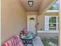 Cozy front porch featuring a seating area, perfect for relaxing and enjoying the outdoors at 72 Dogwood Loop, Ocala, FL 34472