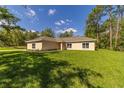 Beautiful one-story home with a spacious front yard and lush landscaping at 8498 Sw 129Th Terrace Rd, Dunnellon, FL 34432