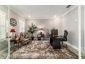 Bright office space featuring a stylish desk, chair, and plantation shutters at 10082 Sw 82Nd Place Rd, Ocala, FL 34481
