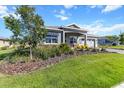 Well-kept home with a green lawn and mature trees in a peaceful neighborhood at 10327 Sw 96Th Loop, Ocala, FL 34481