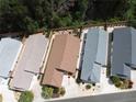 Aerial view of well-maintained homes, showcasing roof lines and landscaping at 3154 Merrit Ln, The Villages, FL 32163